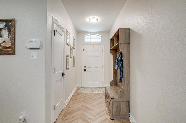 Mudroom with a textured wall | Image 14