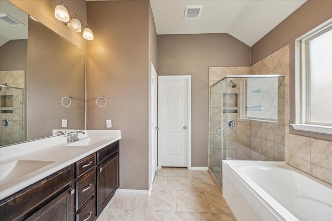Primary Bath with Double Vanity, Seperate Shower, and Soaking Tub. | Image 24
