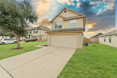 The well-maintained facade creates a charming curb appeal, welcoming you into the heart of the home. | Image 2