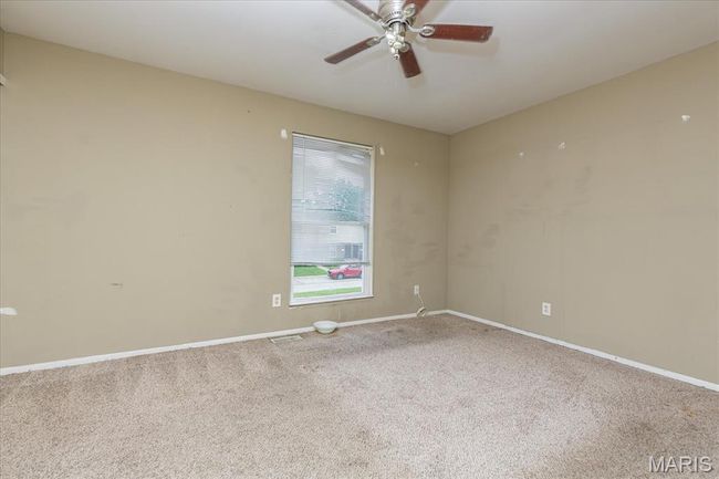 Spare room featuring carpet and a ceiling fan | Image 11