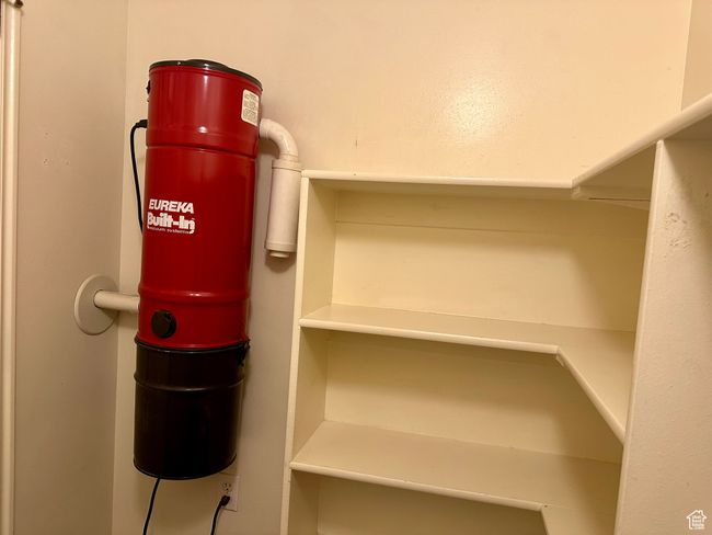 Detailed view of a central vacuum unit and additional shelves | Image 26