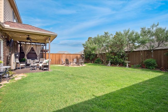 View of yard with a ceiling fan, a patio, and outdoor lounge area | Image 29