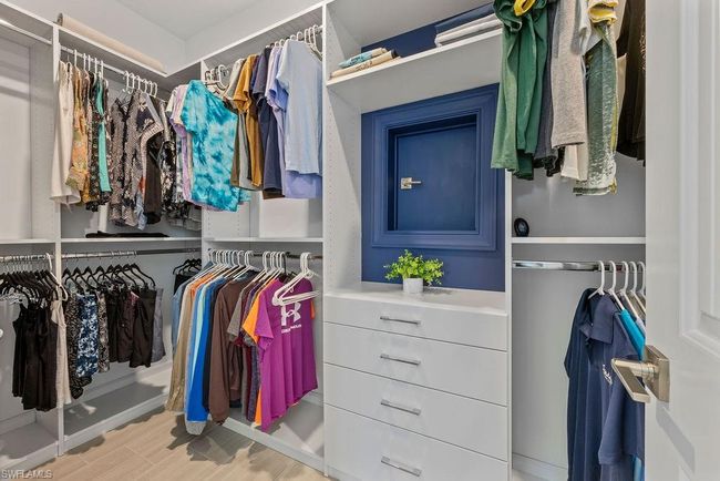 Spacious closet featuring wood finished floors | Image 25