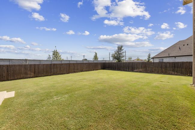 View of fenced backyard that is one of the larger in the area. | Image 39