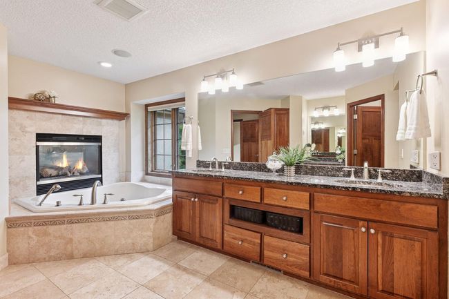 Primary bath with fireplace tub | Image 35