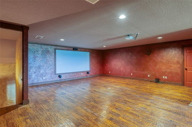 Upstairs media room with surround sound and projection TV. | Image 22