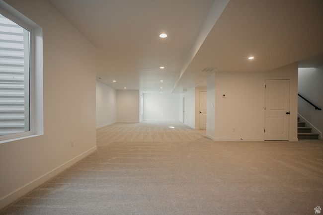 Spare room with recessed lighting, stairway, light carpet, and baseboards | Image 37