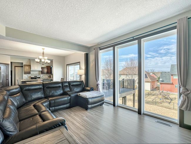Note the HUGE floor to ceiling windows in the living room! | Image 4
