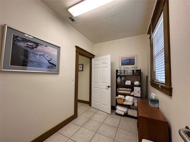 Hall featuring light tile patterned floors and baseboards | Image 18