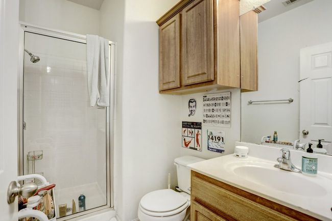 Bathroom featuring a shower stall and vanity | Image 17