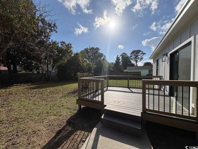 Wooden terrace featuring a yard | Image 33