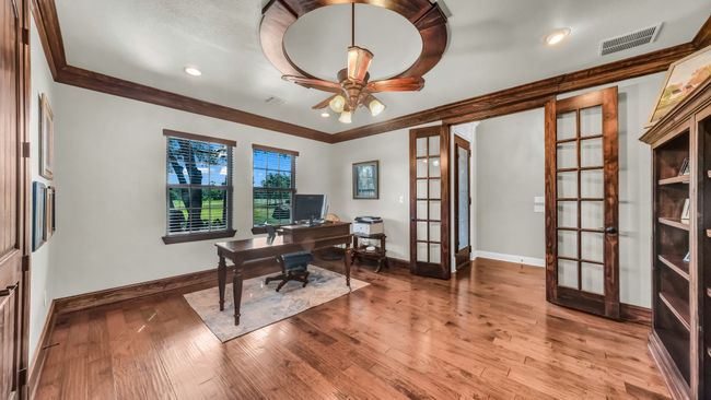 Office with french doors, ornamental molding, wood finished floors, ceiling fan, and recessed lighting | Image 4