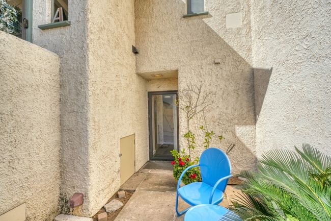 Doorway to lower unit showing courtyard | Image 12