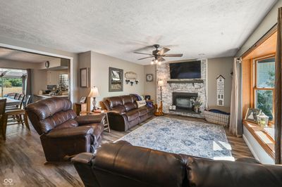 Get cozy in your 14x21 Living Room with gas log fireplace | Image 3