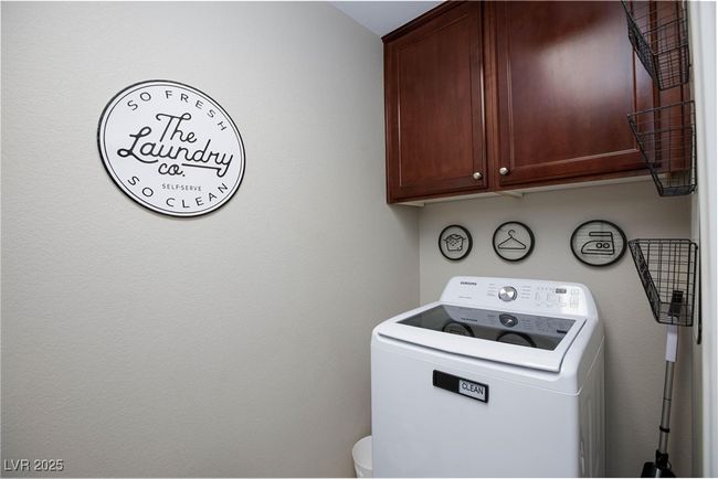 Laundry area featuring washer / dryer and cabinet space | Image 29