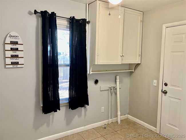 Laundry room with access to back patio and back yard | Image 28