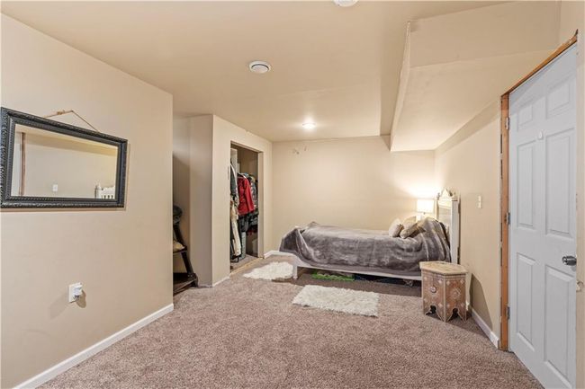 Carpeted bedroom with baseboards, recessed lighting, and a spacious closet | Image 29