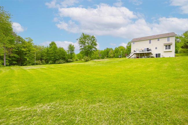 View of grassy yard with a deck and stairway | Image 28