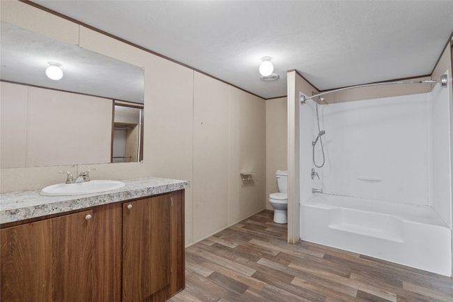 Full bathroom with vanity, and shower / bathtub combination | Image 21