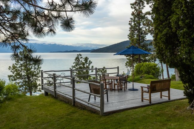 View of dock featuring a lawn and a deck with water view | Image 49