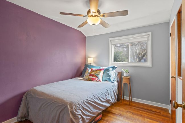Bedroom featuring wood floors, and a ceiling fan | Image 17