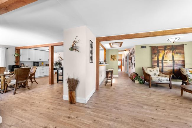 Main Home - From the foyer entrance, the formal living room is on the right and the spacious kitchen & dinette are on the left. | Image 11
