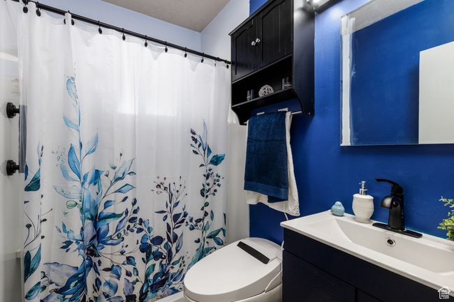 Full bath with vanity and a shower with shower curtain | Image 10