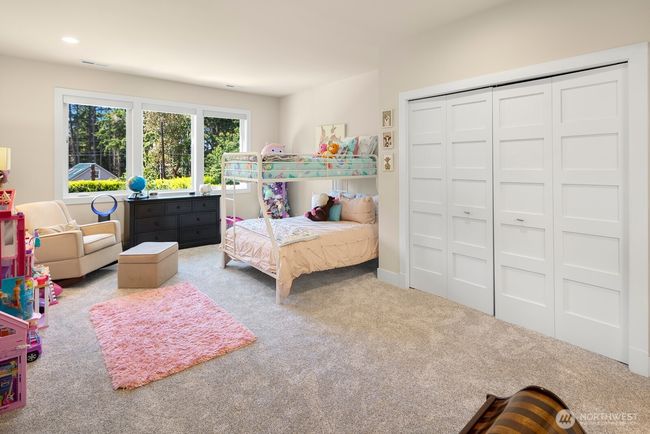 Another oversized bedroom on the upper floor - with space galore, this one overlooks the backyard and has en-suite connection to the hall bathroom. | Image 21
