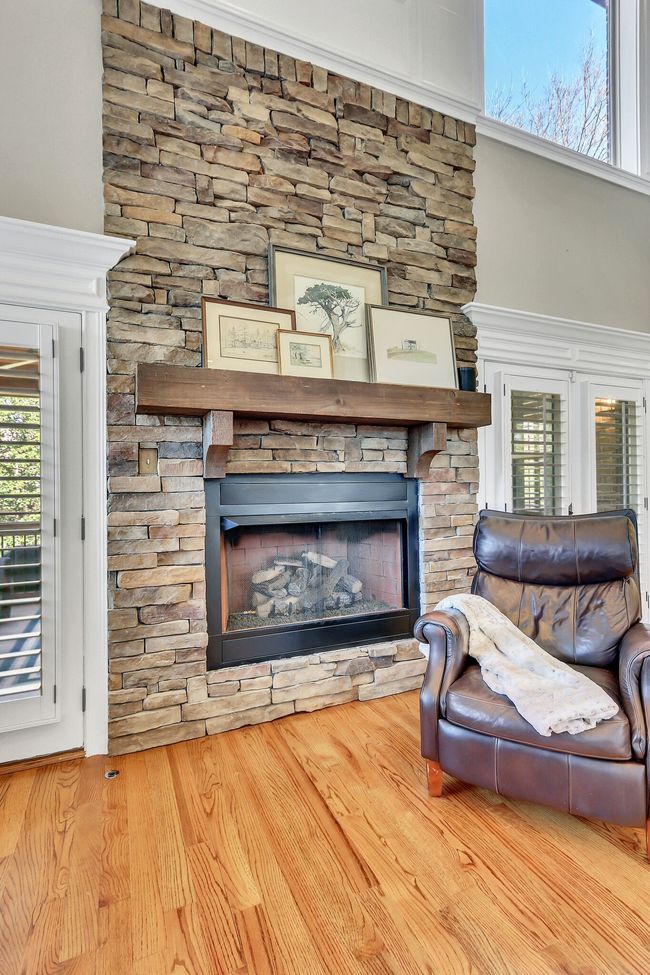 Stacked stone gas fireplace serves as a focal point in your new home. | Image 13