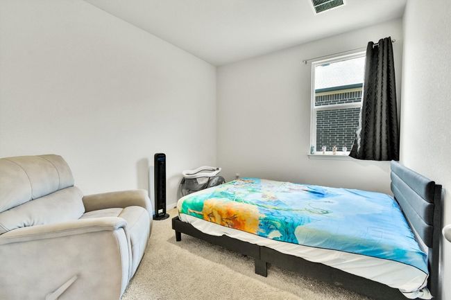 Bedroom with carpet and baseboards | Image 27
