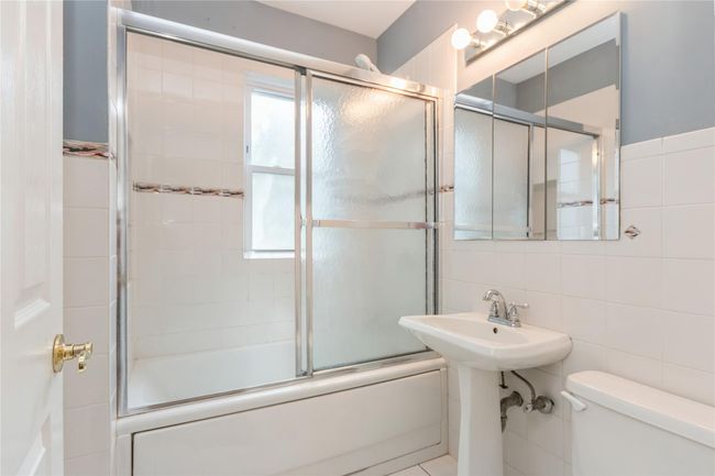 Maind level has a full bath. | Image 13