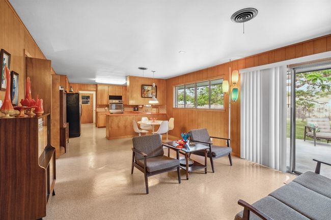 Living room with wood walls | Image 23