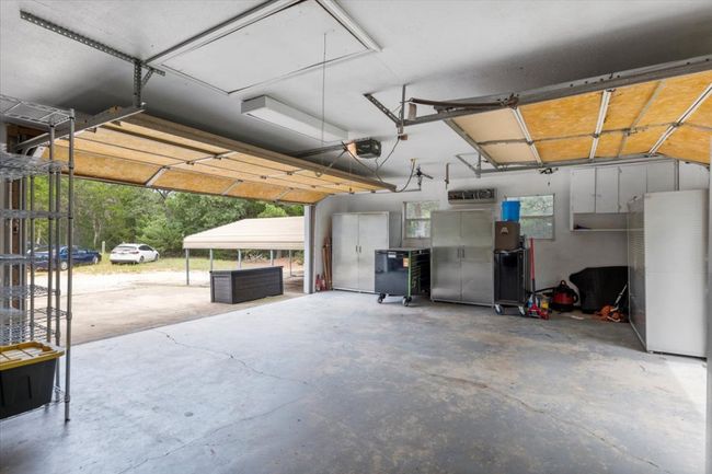 Garage is oversized, has Mini-split system, 2 opposing Garage Doors. | Image 20