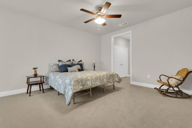 Master Bedroom with carpet, baseboards, and ceiling fan | Image 19