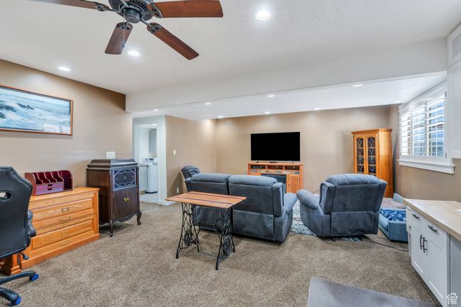 Living room featuring light colored carpet, recessed lighting, and ceiling fan | Image 19