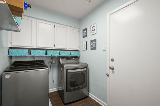 Large laundry room with direct access to the 2 car garage | Image 25