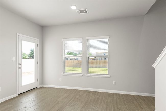 Empty room featuring light wood-style floors and baseboards | Image 11