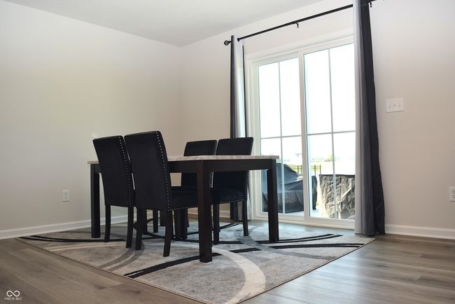 dining area with slider door to patio | Image 22