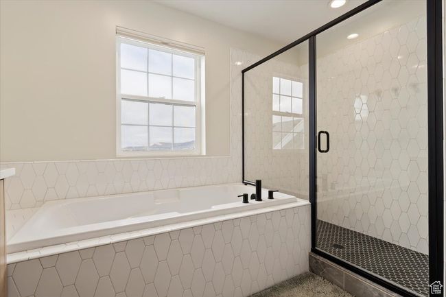 Bathroom featuring a bath, recessed lighting, and a stall shower | Image 20