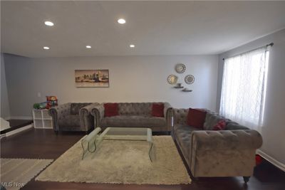 Living room with dark hardwood / wood-style flooring | Image 3