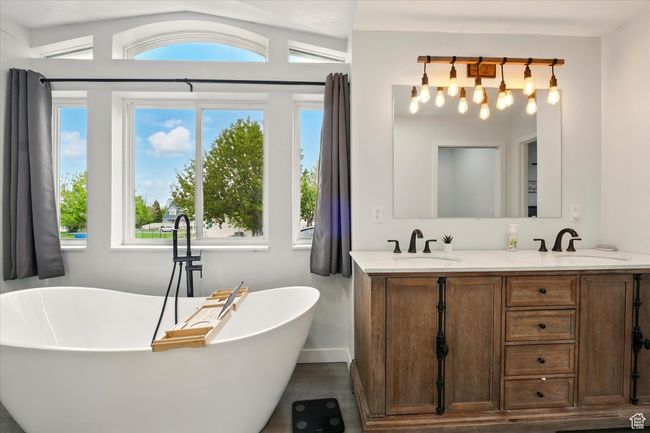 Full bathroom with double vanity and a soaking tub | Image 21