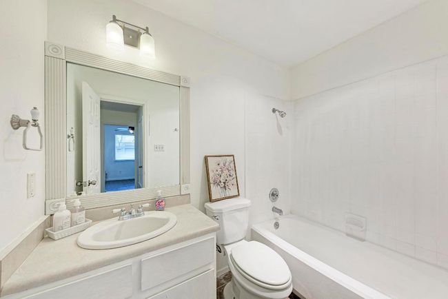 Full bath with shower / washtub combination, toilet, and vanity | Image 23