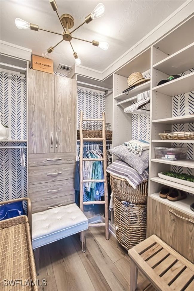 Spacious closet featuring wood finished floors | Image 29