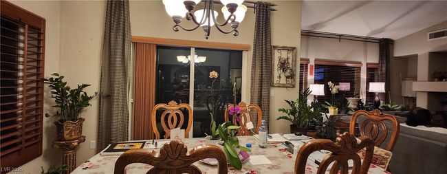 Dining area featuring a chandelier | Image 10