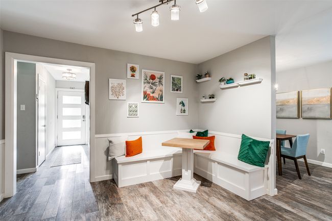 Dining area with breakfast area and wood finished floors | Image 15