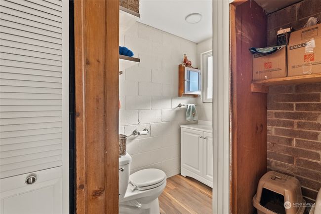 A second view of the lower-level half bath highlights the designated space for a future shower, with plumbing already in place. This setup offers great potential for customization, allowing you to complete the space to suit your needs and style | Image 26