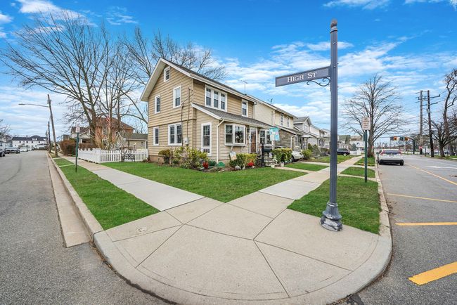 View of front of house featuring a residential view, fence, and a front lawn | Image 28