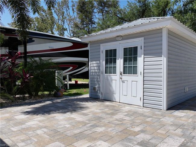 View of outbuilding featuring an outdoor structure | Image 9