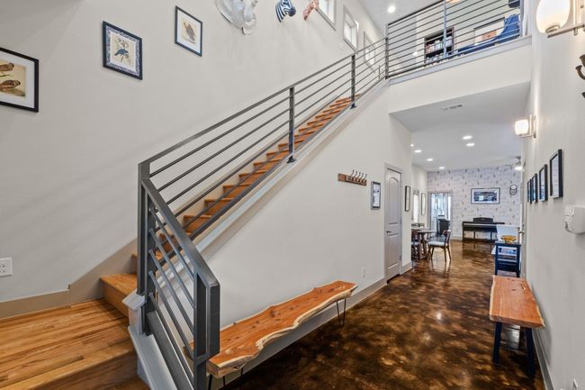 Stairs featuring baseboards, wallpapered walls, recessed lighting, a high ceiling, and visible vents | Image 15