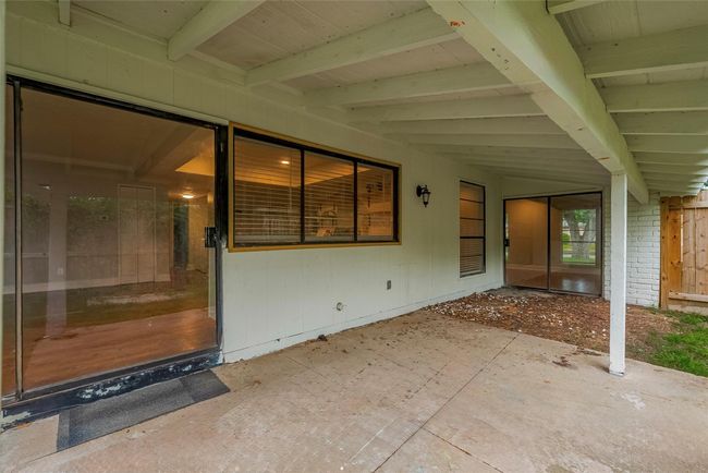 Large covered back patio with so much potential! | Image 25